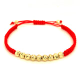 Pulsera (cordón rojo ajustable) en amarillo 10KT