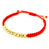 Pulsera (cordón rojo ajustable) en amarillo 10KT