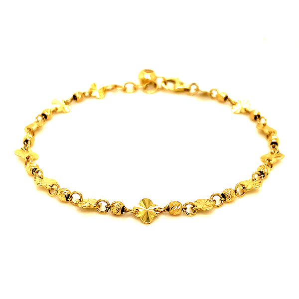 Pulsera (bolitas y trébol) en oro amarillo 10kt.