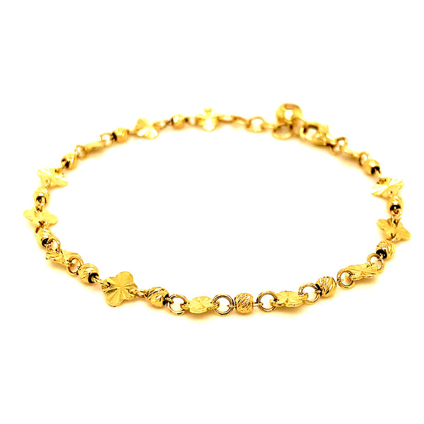 Pulsera (bolitas y trébol) en oro amarillo 10kt.