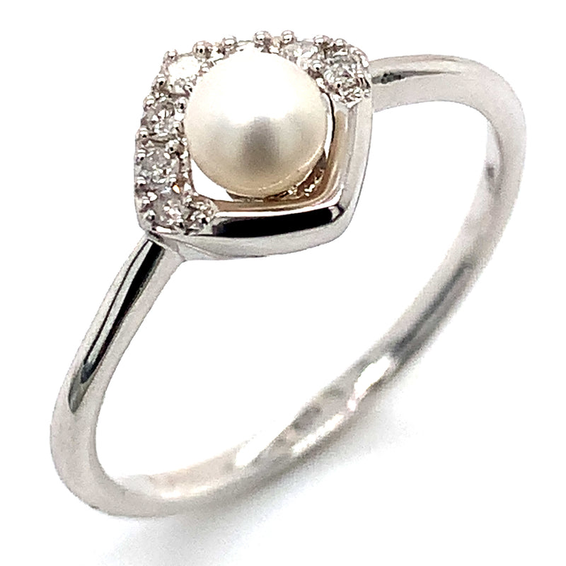 Anillo de perla con diamante en oro blanco 14kt.