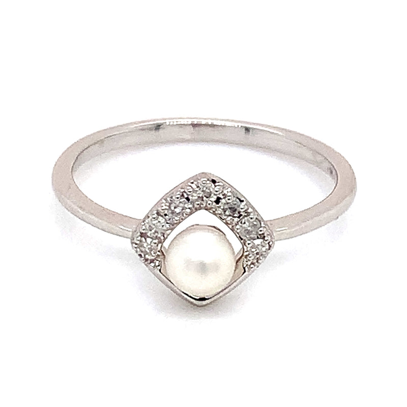 Anillo de perla con diamante en oro blanco 14kt.