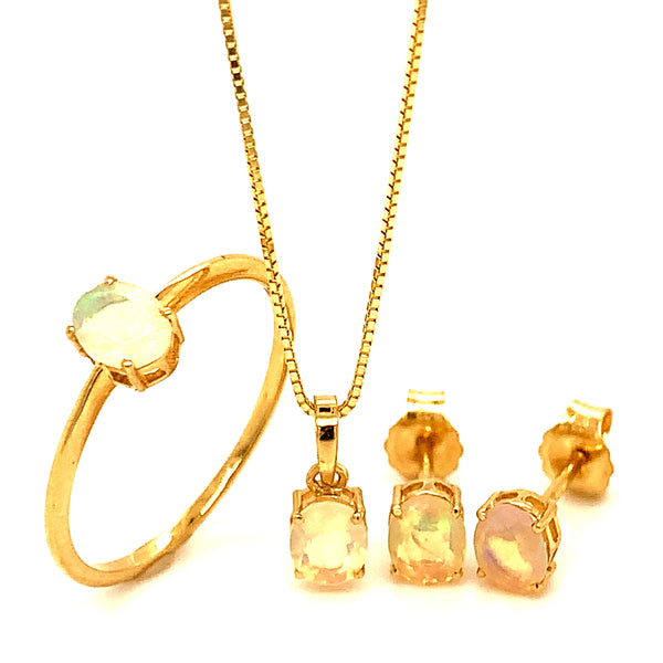 Juego de collar y aretes con ópalo en oro amarillo 10k.