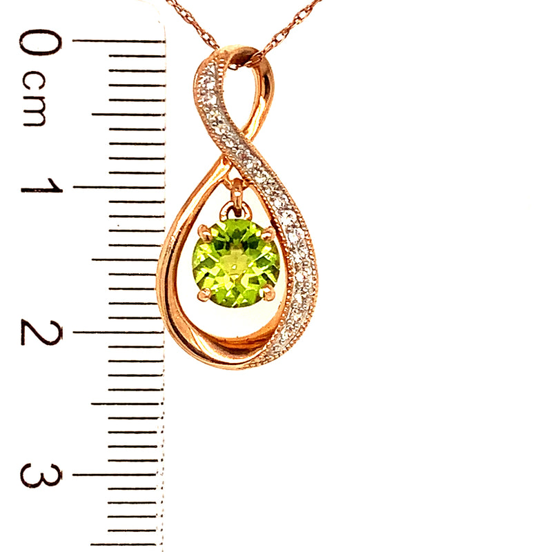 Collar de Peridoto con Zafiros blancos en oro rosado 14kt.  ANTES:  $399.00