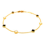 Pulsera (trébol nacar blanco y onix negro) en amarillo 18k. 19cm