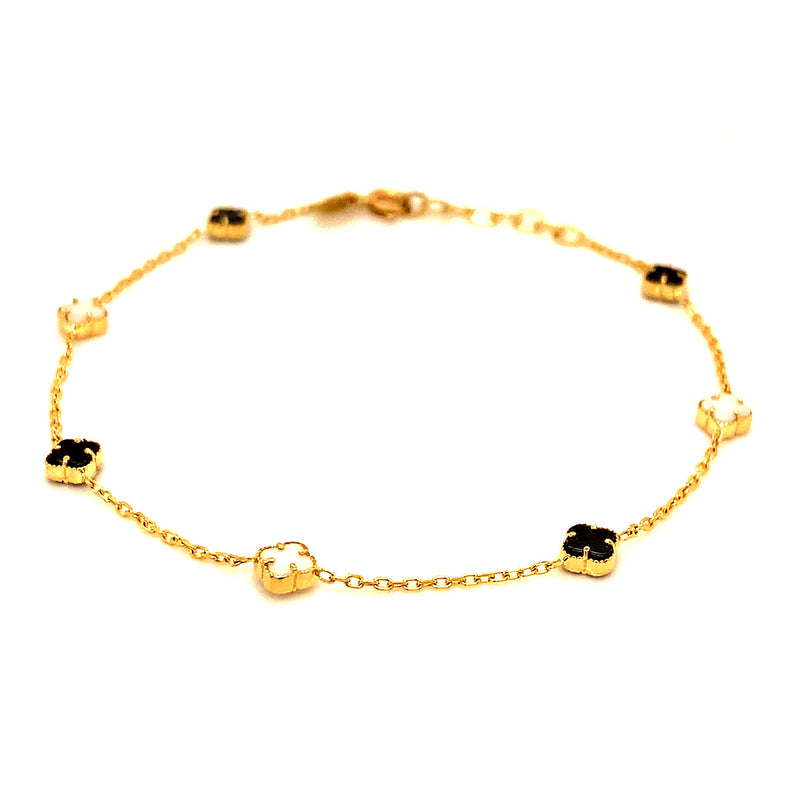 Pulsera (trébol nacar blanco y onix negro) en amarillo 18k. 19cm