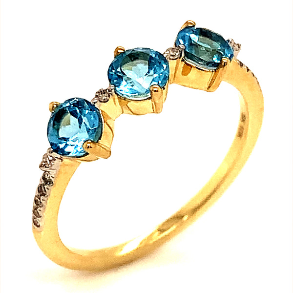 Anillo de topacio azul con diamantes en oro amarillo 10kt.