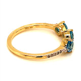 Anillo de topacio azul con diamantes en oro amarillo 10kt.