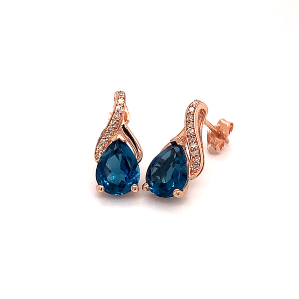 Aretes de topacio azul en oro rosado 14kt