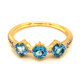 Anillo de topacio azul con diamantes en oro amarillo 10kt.