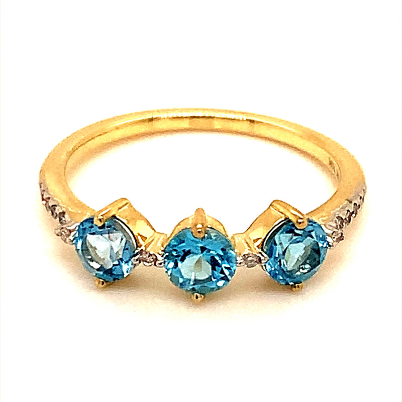 Anillo de topacio azul con diamantes en oro amarillo 10kt.