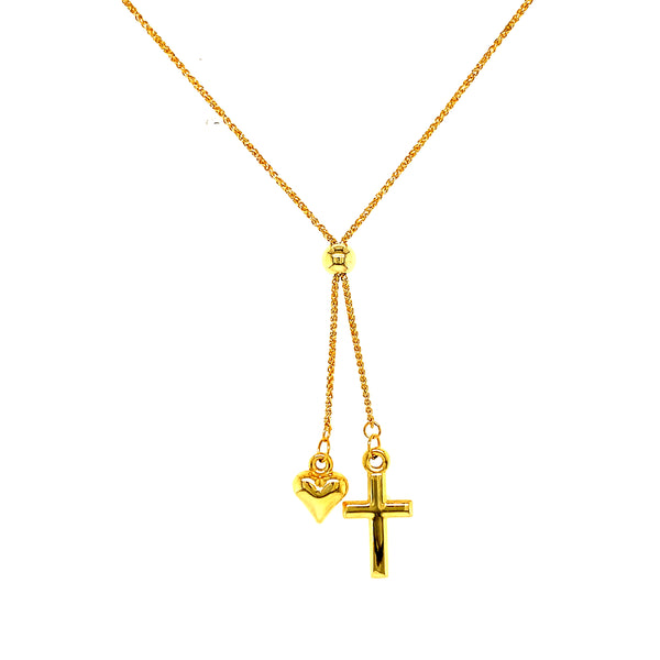 Collar tipo corbatín (corazón y cruz) en oro amarillo 10k. 45cm