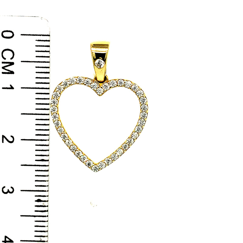 Dije (corazón) con circones en oro amarillo 10kt.