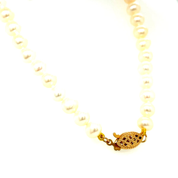 Pulsera de perlas blancas en oro amarillo 14kt. 19cm