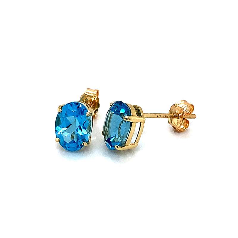 Aretes con topacio azul en oro amarillo 14k