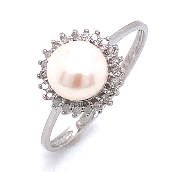 Anillo de perla con diamante en oro blanco 14kt.