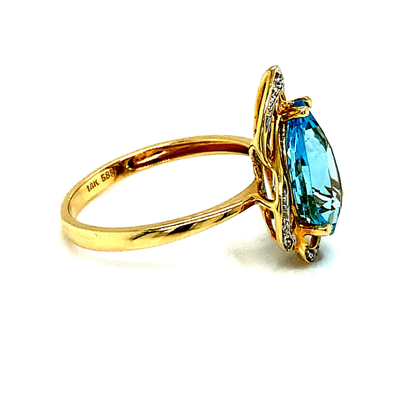 Anillo de topacio azul con diamantes en oro amarillo 14k