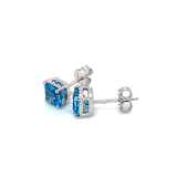 Aretes de topacio azul en oro blanco 14kt