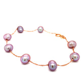 Pulsera de perlas moradas en oro rosado 14Kt. 19cm