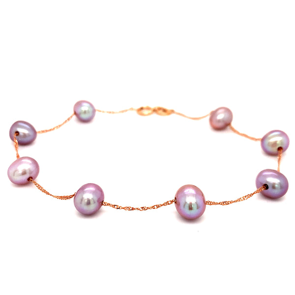 Pulsera de perlas moradas en oro rosado 14Kt. 19cm