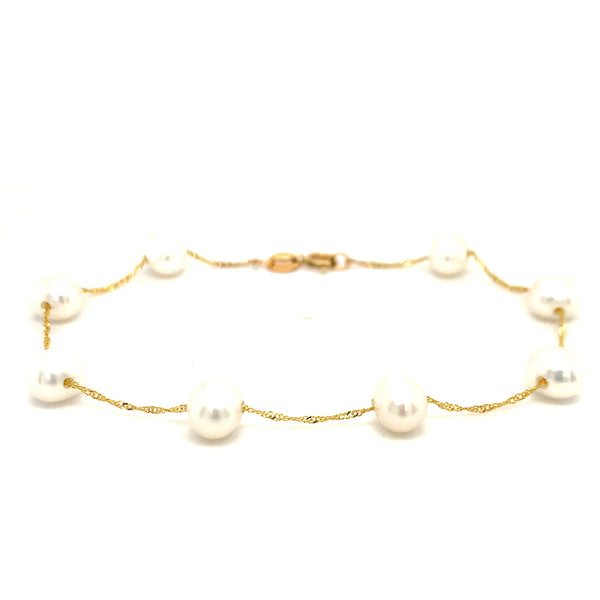 Pulsera de perlas blancas en oro amarillo 14Kt. 19cm