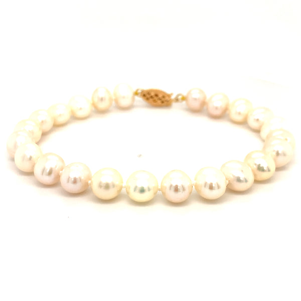 Pulsera de perlas blancas en oro amarillo 14kt. 19cm  ANTES:  $225.00