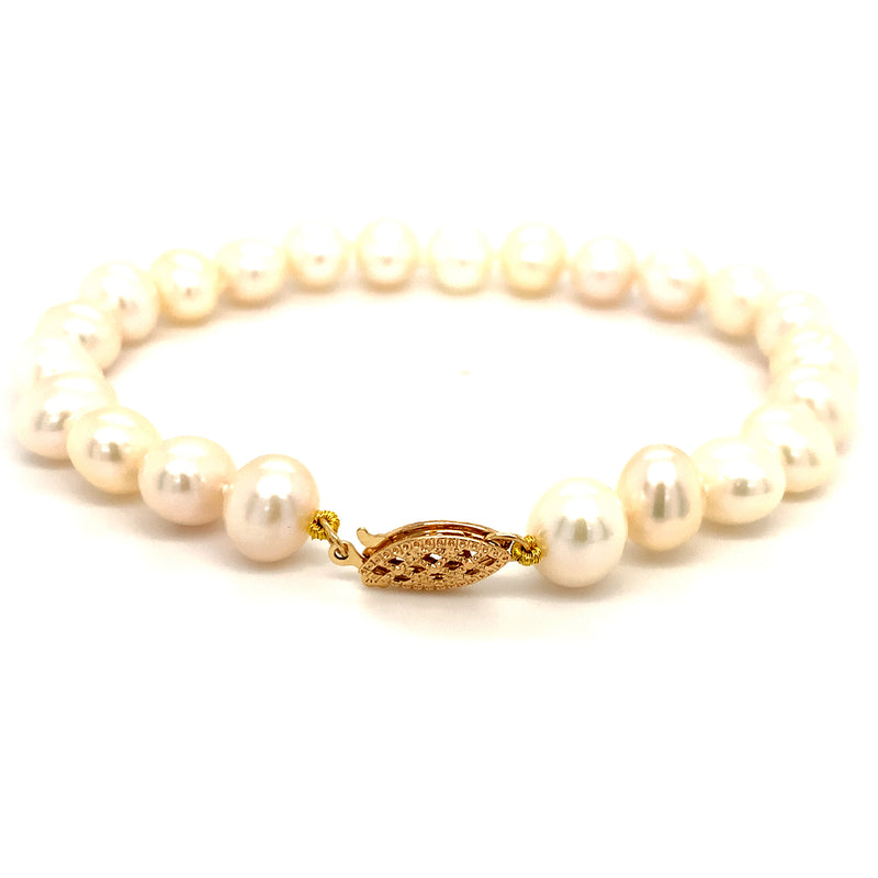 Pulsera de perlas blancas en oro amarillo 14kt. 19cm