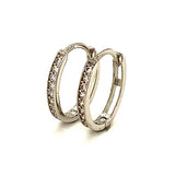 Huggies ovalados con circones en oro blanco 10KT