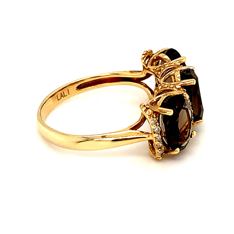 Anillo de topacio humo con diamantes en oro amarillo 14kt.